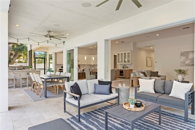 view of patio / terrace with an outdoor hangout area, visible vents, area for grilling, outdoor dining space, and a sink