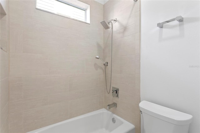 full bathroom featuring tub / shower combination and toilet