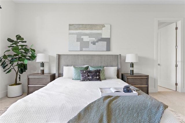 carpeted bedroom featuring baseboards