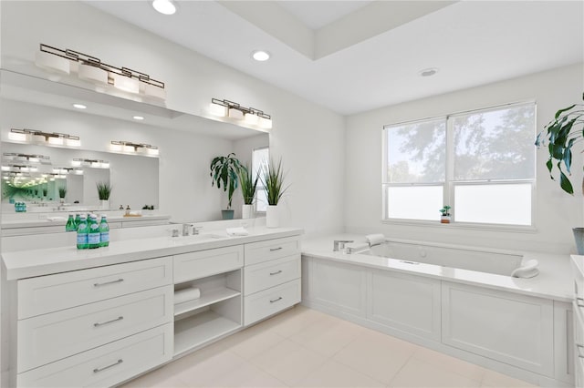 bathroom featuring a bath, recessed lighting, and vanity