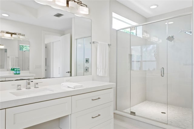 full bathroom with vanity, visible vents, recessed lighting, and a shower stall
