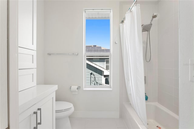 full bath with tile patterned floors, toilet, vanity, shower / bath combo, and baseboards