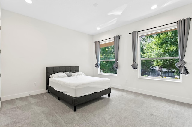 bedroom featuring carpet floors, baseboards, and recessed lighting