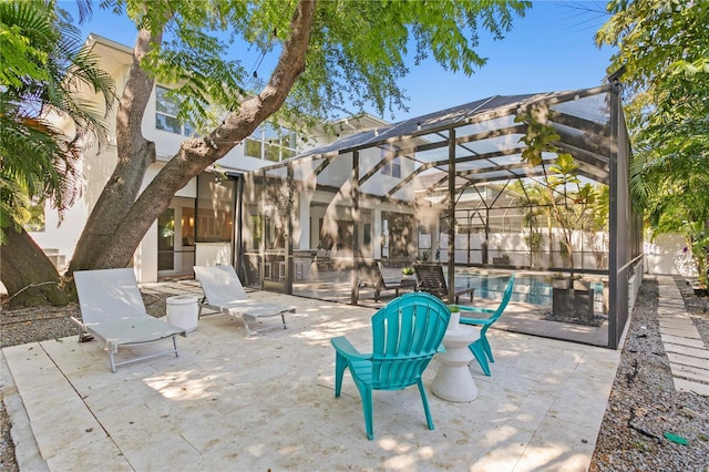 view of patio featuring glass enclosure and a fenced in pool