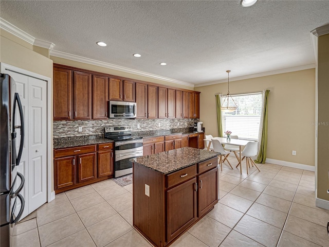 kitchen with crown molding, backsplash, and stainless steel appliances