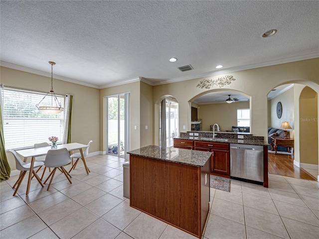 kitchen featuring visible vents, dishwasher, a sink, and light tile patterned floors