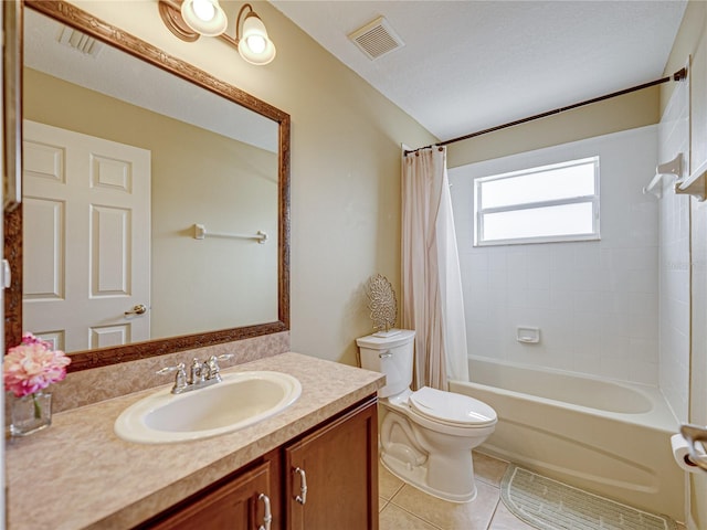 bathroom with vanity, tile patterned flooring, toilet, visible vents, and shower / bath combo with shower curtain