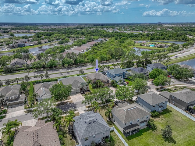 aerial view with a residential view and a water view