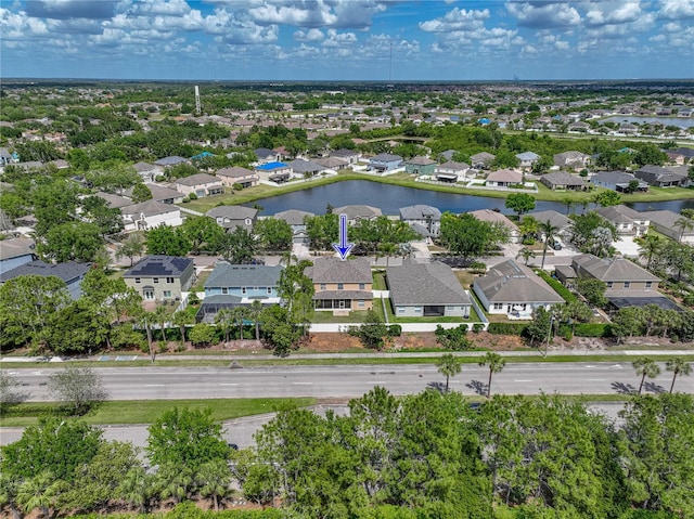 drone / aerial view featuring a residential view and a water view