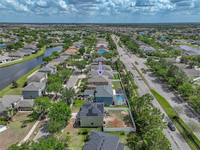 aerial view featuring a water view and a residential view