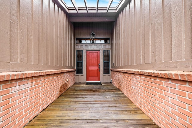 view of exterior entry featuring board and batten siding