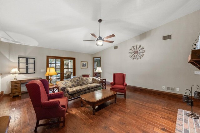 living room featuring ceiling fan, visible vents, and hardwood / wood-style flooring
