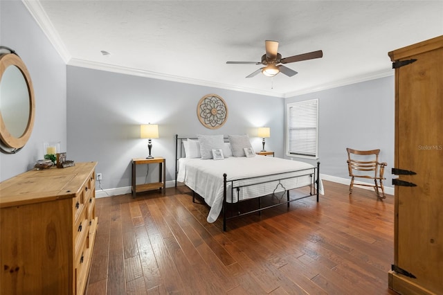 bedroom featuring crown molding, baseboards, and dark wood-style floors