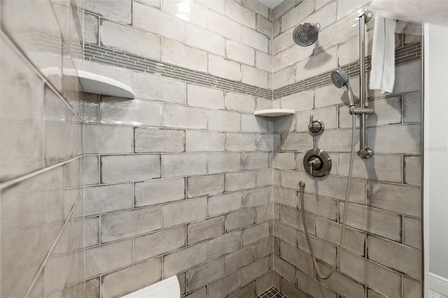 bathroom with tiled shower