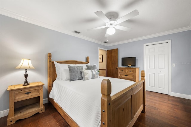 bedroom with ornamental molding, visible vents, baseboards, and dark wood-style floors