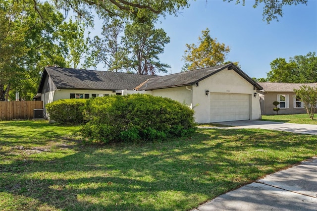 14013 Briardale Ln, Tampa, FL 33618 - single story home featuring concrete driveway, central air condition unit, an attached garage, a front yard, and fence