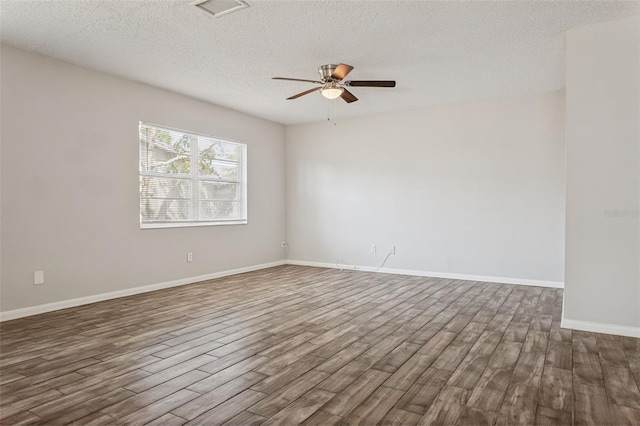 14013 Briardale Ln, Tampa, FL 33618 - spare room featuring a ceiling fan, a textured ceiling, baseboards, and dark wood-style floors
