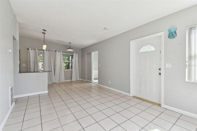 entrance foyer with baseboards and visible vents