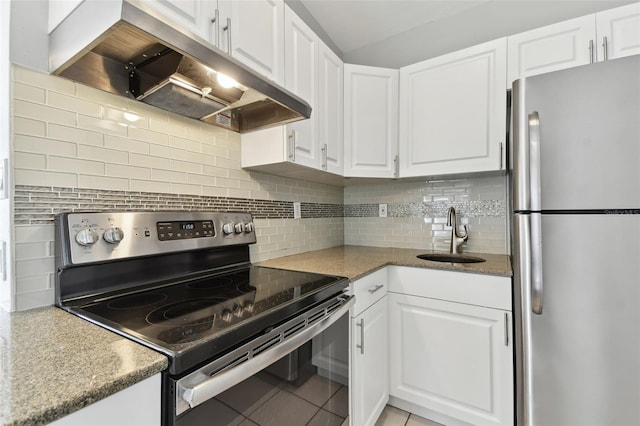 kitchen with under cabinet range hood, a sink, white cabinetry, and stainless steel appliances