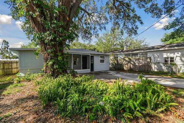 back of house featuring fence