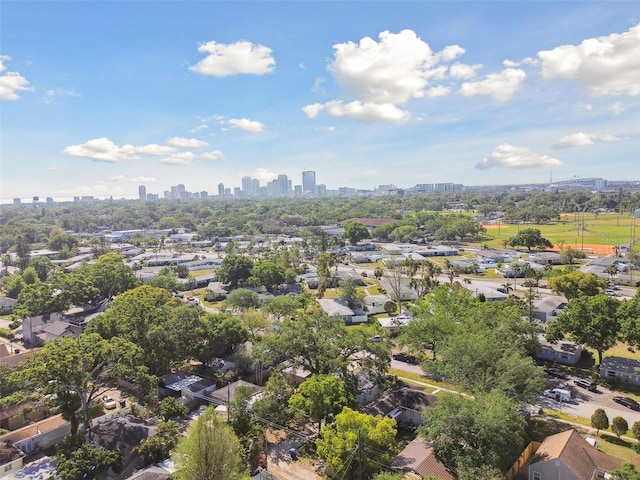 birds eye view of property featuring a city view and a residential view