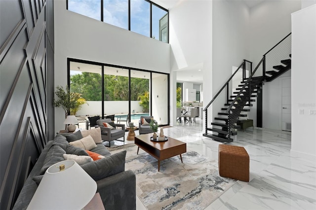 7608 Antilla St, Tampa, FL 33625 - living area featuring marble finish floor, baseboards, stairway, and visible vents