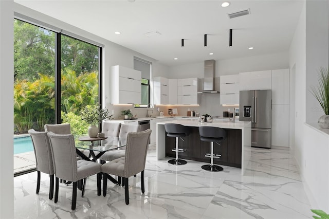 7608 Antilla St, Tampa, FL 33625 - dining room featuring marble finish floor, visible vents, and recessed lighting