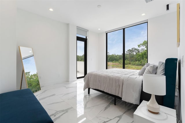 7608 Antilla St, Tampa, FL 33625 - bedroom with a wall of windows, baseboards, marble finish floor, recessed lighting, and access to exterior