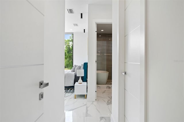 7608 Antilla St, Tampa, FL 33625 - ensuite bathroom with ensuite bathroom, marble finish floor, visible vents, and a freestanding bath