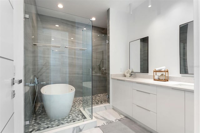 7608 Antilla St, Tampa, FL 33625 - bathroom with a freestanding tub, a shower stall, marble finish floor, a sink, and double vanity