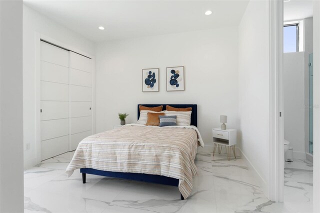 7608 Antilla St, Tampa, FL 33625 - bedroom with baseboards, marble finish floor, a closet, and recessed lighting