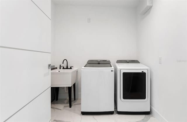 7608 Antilla St, Tampa, FL 33625 - washroom featuring washing machine and clothes dryer, marble finish floor, baseboards, and laundry area