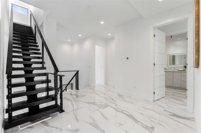 7608 Antilla St, Tampa, FL 33625 - staircase featuring marble finish floor and recessed lighting