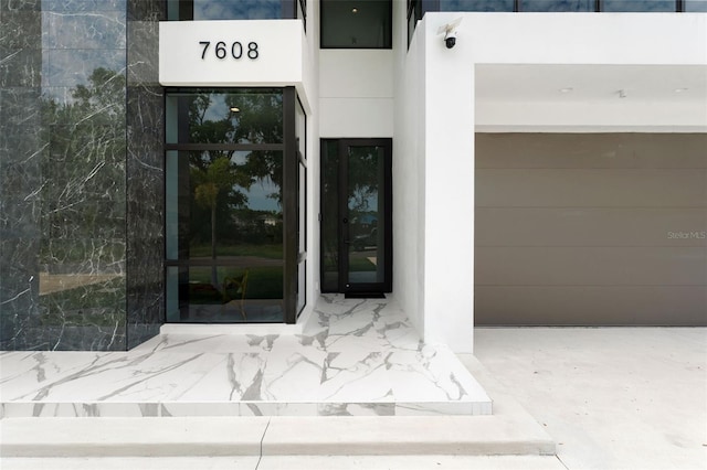 7608 Antilla St, Tampa, FL 33625 - view of exterior entry featuring stucco siding