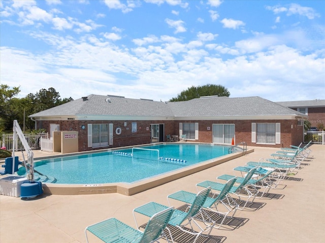 pool featuring a patio area and fence