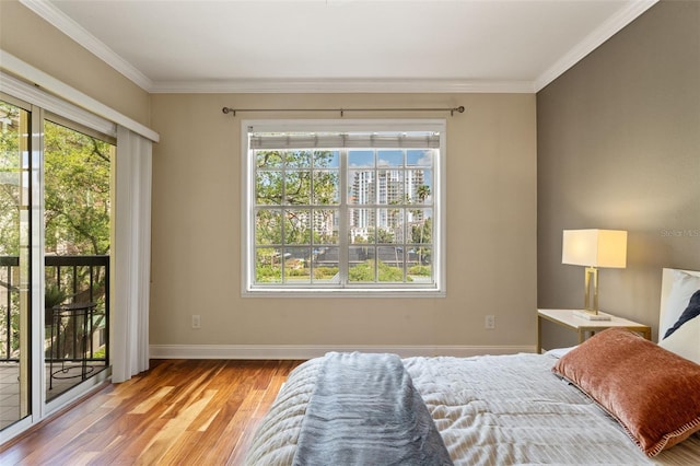 1002 S Harbour Island Blvd Unit 1312, Tampa, FL 33602 - bedroom with baseboards, access to exterior, crown molding, and wood finished floors