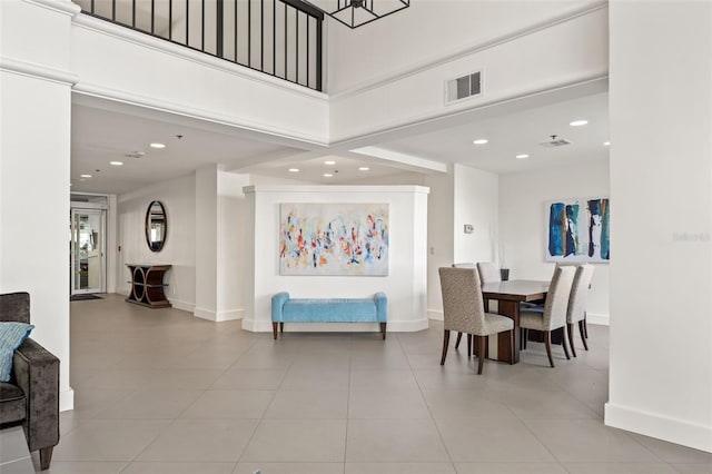 1002 S Harbour Island Blvd Unit 1312, Tampa, FL 33602 - dining space with recessed lighting, light tile patterned floors, baseboards, a high ceiling, and visible vents