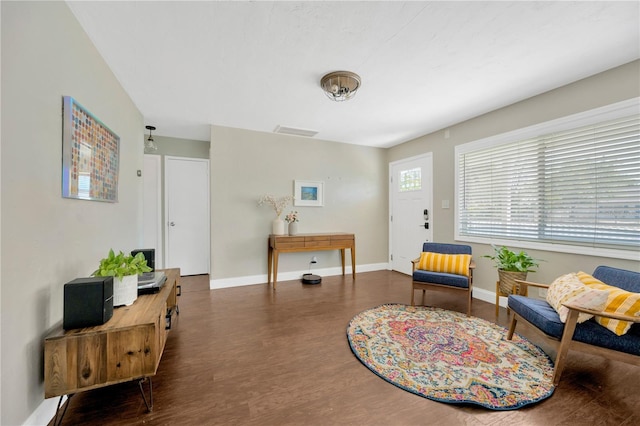 5367 5th Ave N, Saint Petersburg, FL 33710 - living area featuring baseboards, visible vents, and wood finished floors