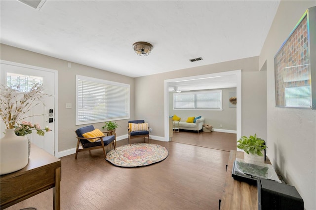 5367 5th Ave N, Saint Petersburg, FL 33710 - living area with wood finished floors, baseboards, and visible vents