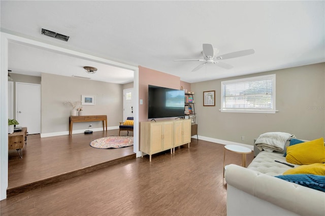 5367 5th Ave N, Saint Petersburg, FL 33710 - living room with wood finished floors, visible vents, baseboards, and ceiling fan