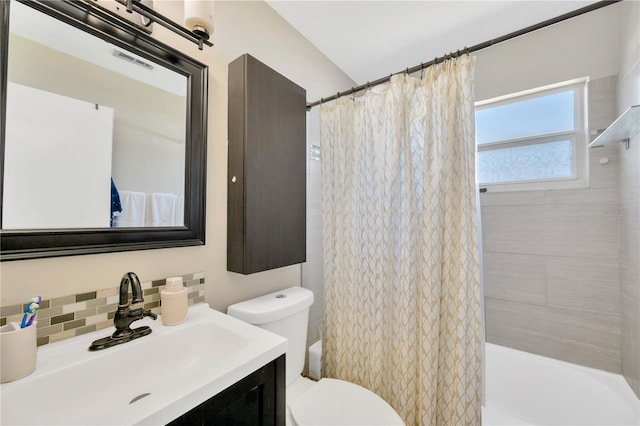 5367 5th Ave N, Saint Petersburg, FL 33710 - bathroom featuring toilet, vanity, shower / bath combo, visible vents, and decorative backsplash