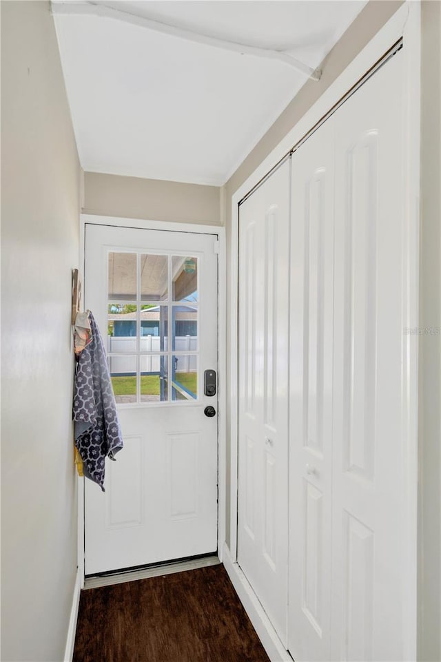 5367 5th Ave N, Saint Petersburg, FL 33710 - doorway to outside featuring baseboards and dark wood finished floors