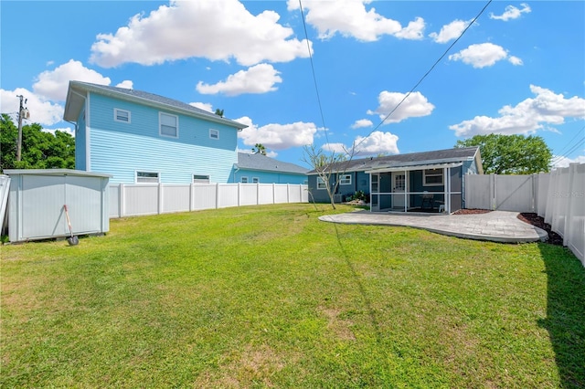5367 5th Ave N, Saint Petersburg, FL 33710 - view of yard with a fenced backyard, a sunroom, and a patio