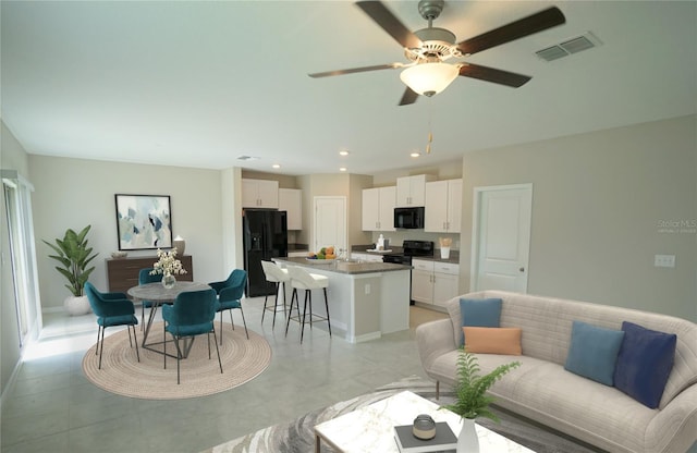 1038 Ocean Spray Dr, Ruskin, FL 33570 - living room with ceiling fan, recessed lighting, and baseboards