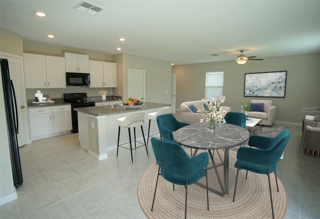 1038 Ocean Spray Dr, Ruskin, FL 33570 - dining space featuring light tile patterned floors, ceiling fan, recessed lighting, and baseboards