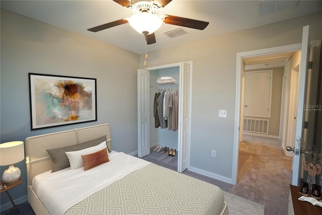 1038 Ocean Spray Dr, Ruskin, FL 33570 - carpeted bedroom featuring a closet, baseboards, and a ceiling fan