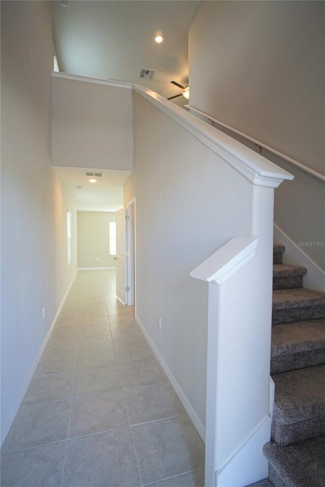 1038 Ocean Spray Dr, Ruskin, FL 33570 - hallway featuring tile patterned flooring, recessed lighting, stairs, and baseboards