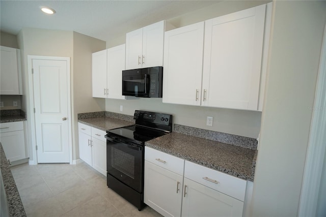 1038 Ocean Spray Dr, Ruskin, FL 33570 - kitchen with black appliances, white cabinetry, recessed lighting, and light tile patterned flooring