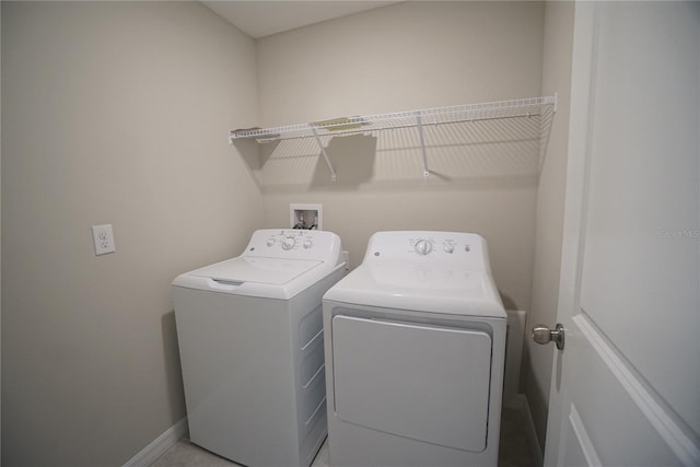 1038 Ocean Spray Dr, Ruskin, FL 33570 - laundry room with independent washer and dryer and baseboards