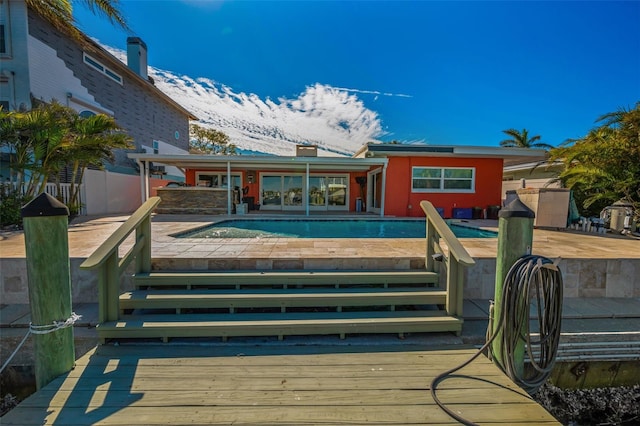 366 La Hacienda Dr, Indian Rocks Beach, FL 33785 - back of house featuring an outdoor pool, fence, and a deck